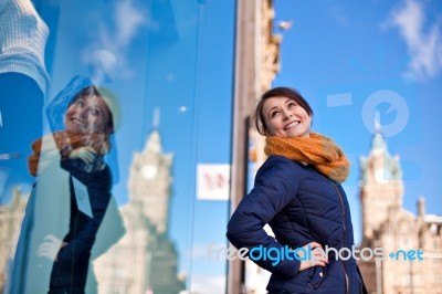 Girl Is Looking At Shop Window Stock Photo