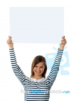 Girl Lifting Blank Placard High Stock Photo