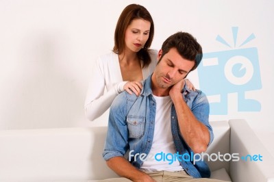 Girl Massaging Her Husband Stock Photo
