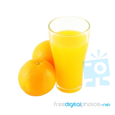 Glass Of Orange Juice And Two Fruit Side On White Background Stock Photo
