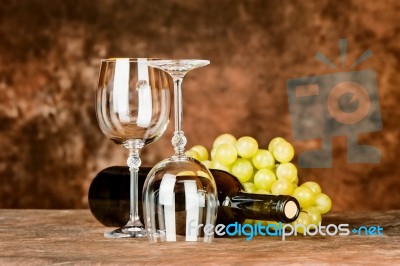 Glasses With Wine Bottle And Grapes Stock Photo