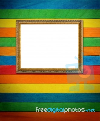 Gold Picture Frame On Colorful Wood Stock Photo