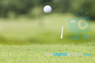Golf Ball Just Coming Off The Tee Stock Photo