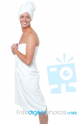 Gorgeous Female In Bath Towel Posing Sideways Stock Photo