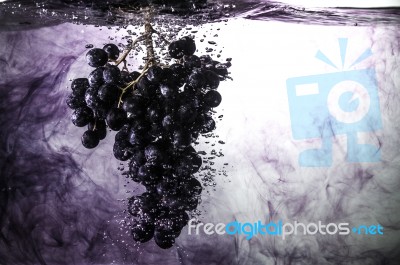Grape In Water Stock Photo