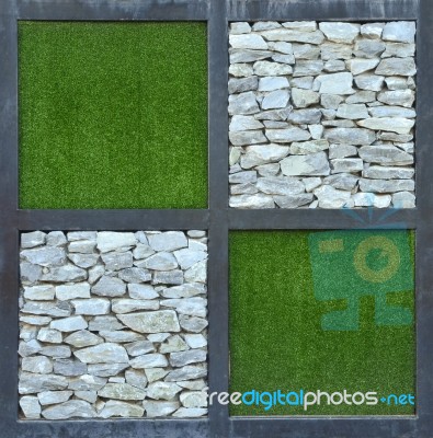 Grass And Stone Wall Background Stock Photo