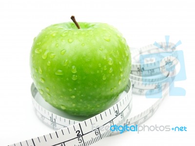 Green Apple And Measuring Tape Stock Photo