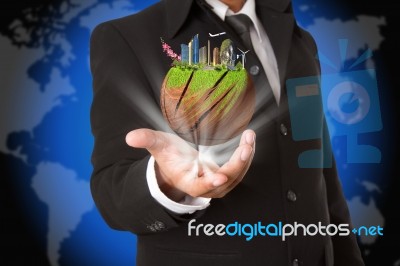 Green Earth In Business Hand Concept Stock Photo