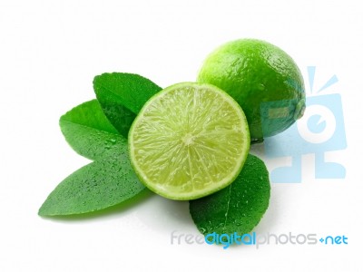 Green Limes With Leaves Stock Photo