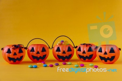 Halloween Jack O Lantern Bucket Filled With Candies Stock Photo