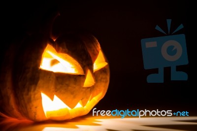 Halloween Scary Face Pumpkin  On Black Background Stock Photo