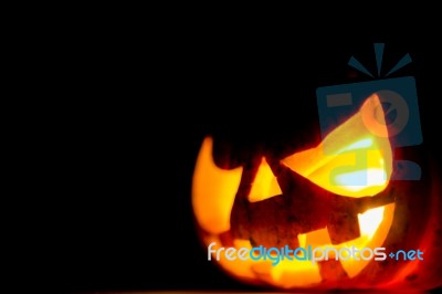Halloween Scary Face Pumpkin  On Black Background Stock Photo
