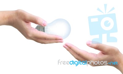 Hand Giving Lightbulb Stock Photo