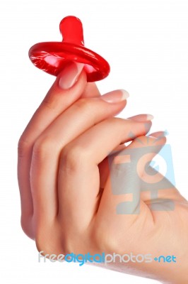 Hand Holding A Condom Stock Photo