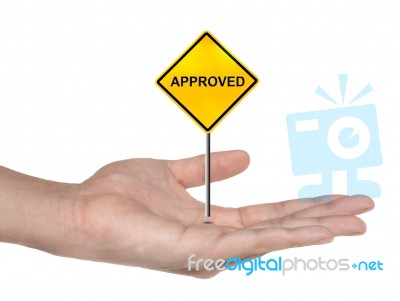 Hand Holding Approved Sign Stock Photo