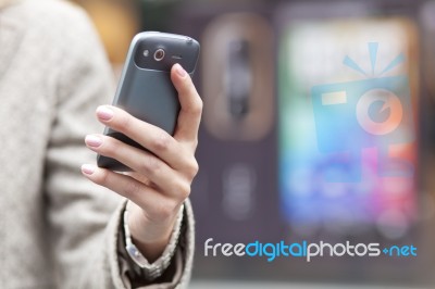 Hand holding Cell Phone Stock Photo