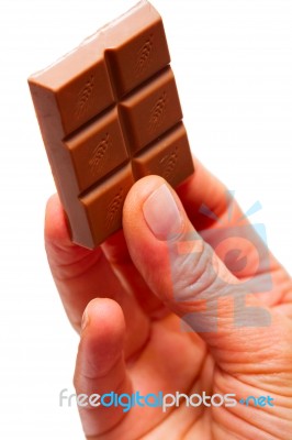 Hand Holding Chocolate Stock Photo