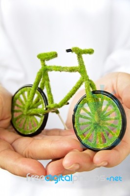 Hand Holding Eco Bicycle Stock Photo