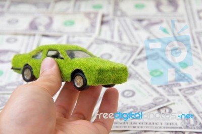 Hand Holding Eco Car Stock Photo