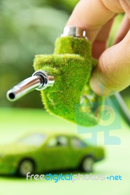 Hand Holding Eco Fuel Nozzle Stock Photo