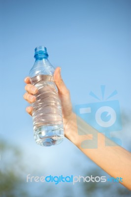 Hand Holding Plasic Bottle Of Water Stock Photo