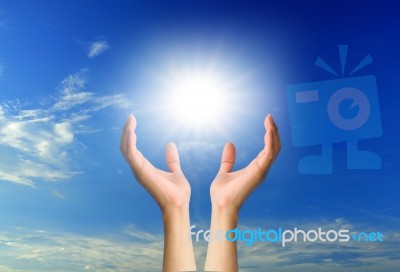 Hand Holding Sun Stock Photo