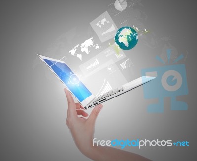 Hand Holding Thin Laptop With Screen And Graph,social Network Out Stock Photo