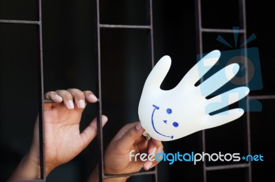 Hand In Jail Showing Smiling Glove Stock Photo