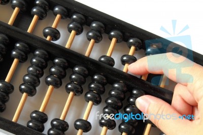 Hand Using A Wooden Abacus  Stock Photo