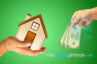 Hand With House And Money Stock Image