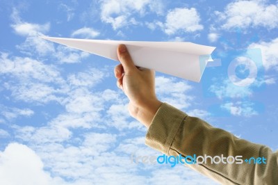 Hand With Paper Plane Stock Photo