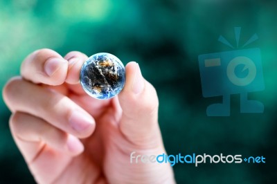 Hands And Earth Stock Photo