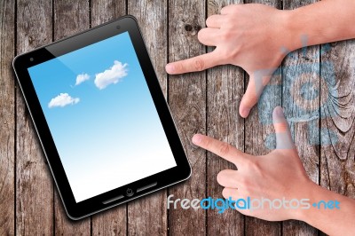 Hands Pointing To Touch Pad Stock Photo