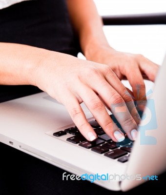 Hands Typing On Laptop Stock Photo