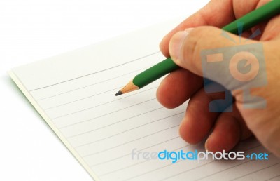 Hands With Pen Over lined Paper Stock Photo