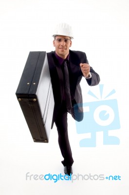 Handsome Young Architect In Running Gesture Stock Photo
