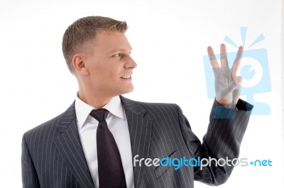 Happy Businessman Counting Fingers Stock Photo