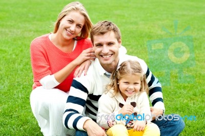 Happy Family In Park Stock Photo