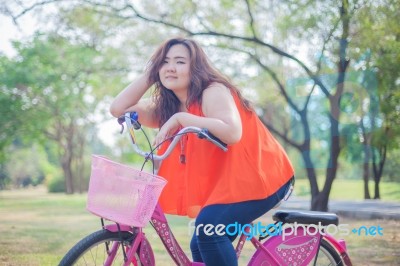 Happy Woman Posing With Bicycle Stock Photo
