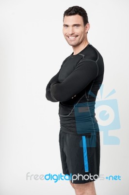 Happy Fit Male With Arms Crossed Stock Photo