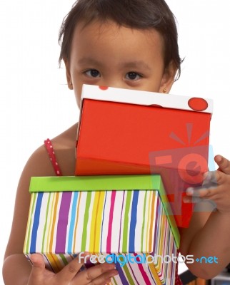 Happy Girl Receiving Gifts Stock Photo