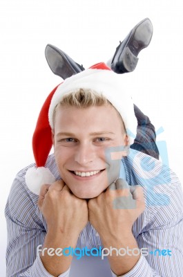 Happy Laying Man With Christmas Hat Stock Photo