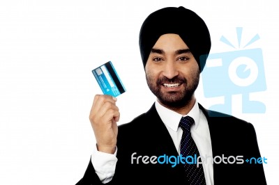 Happy Male Executive Holding Credit Card Stock Photo