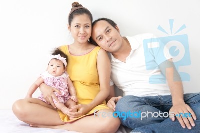 Happy Of A New Family On White Background Stock Photo