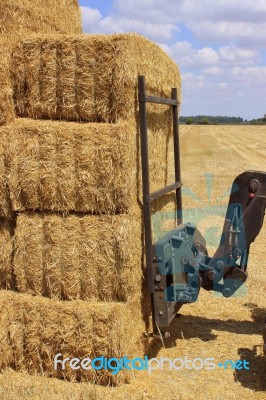 Haystack Field with vehicle Stock Photo