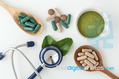 Herbal Medicine In Capsules With Stethoscope Stock Photo