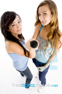 High Angle View Of Girls Holding Microphone Stock Photo
