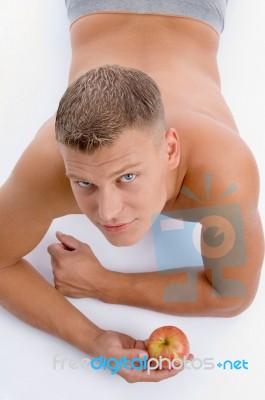 High Angle View Of Man With Apple Stock Photo