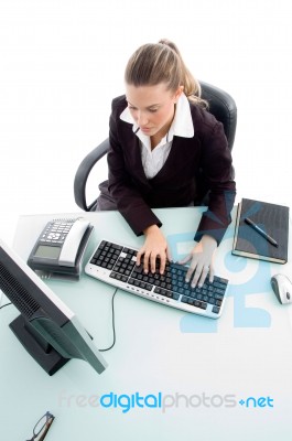 High Angle View Of Woman Working On Computer Stock Photo