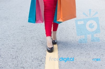 High Heels Girls With Shopping Bags Walking On Street Stock Photo